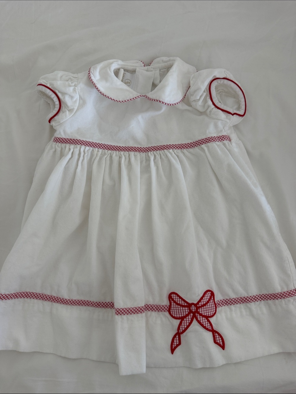 White Dress with Red Dress Trim and Bow Detail